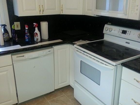 White kitchen green granite
