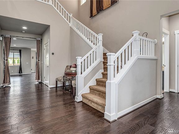 Dramatic Staircase and Hardwoods on Main Floor