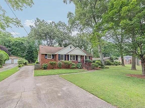 Front of the home with large multiple car driveway