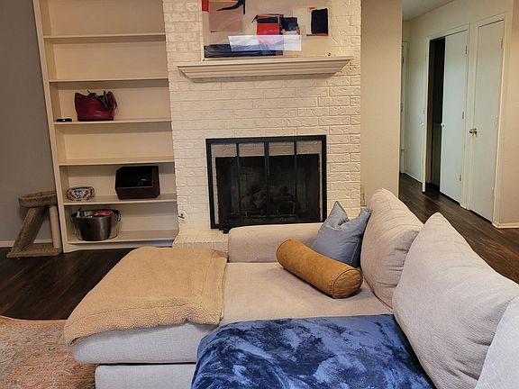Living with fireplace and built-in bookcase