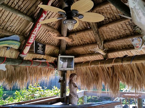 Festive Tiki bar by waterway