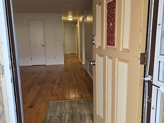 Beautiful, large living room area with handscraped hardwood floors