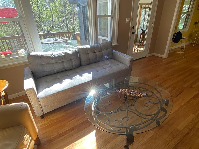 Living room with front deck in view