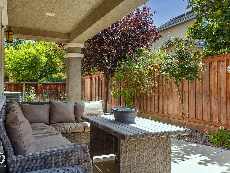 shaded back portico and yard