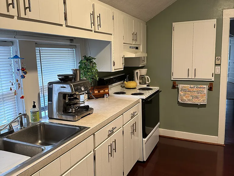 Lots of cabinets including spice cabinet.