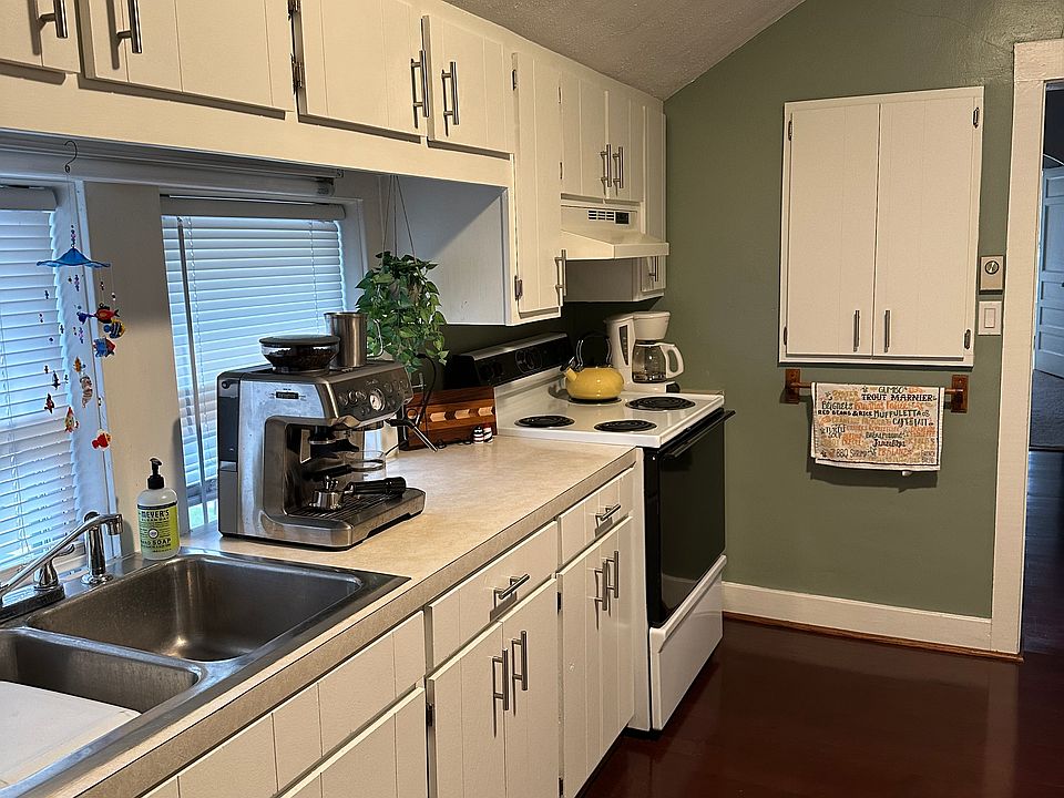 Lots of cabinets including spice cabinet.
