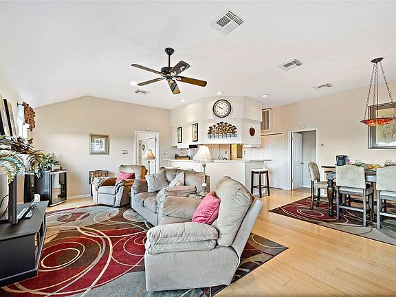 Large windows allowing plenty of natural sunlight to illuminate the living space