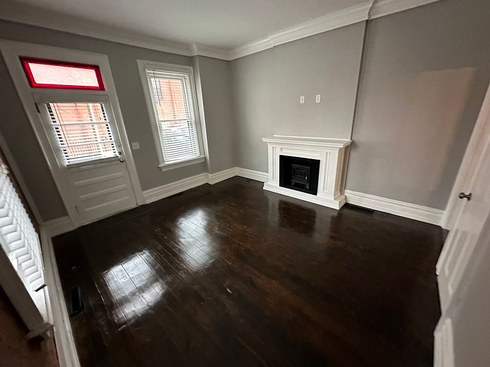 Living Room w/ refinished original hardwood floors, Nest thermostat