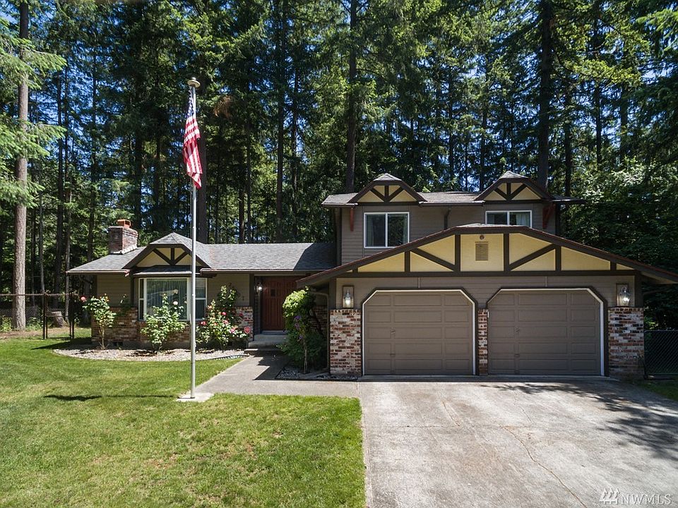 Lovingly maintained, this property has a bright and sunny front yard and a private, shaded wood in the back.