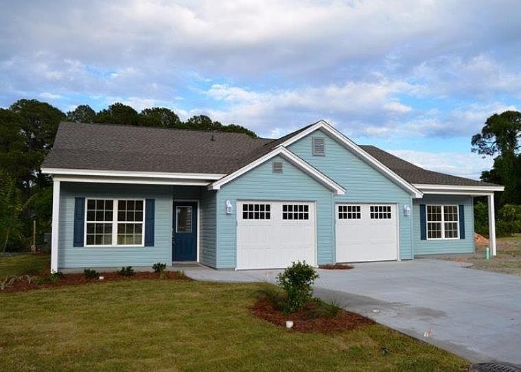 The duplex for rent is on the left (Unit A). This duplex stands alone on a large lot on the banks of the lake. The sun rises on the lake side where you can enjoy your morning coffee and watch the ducks swim in the lake. There is storm retention area on