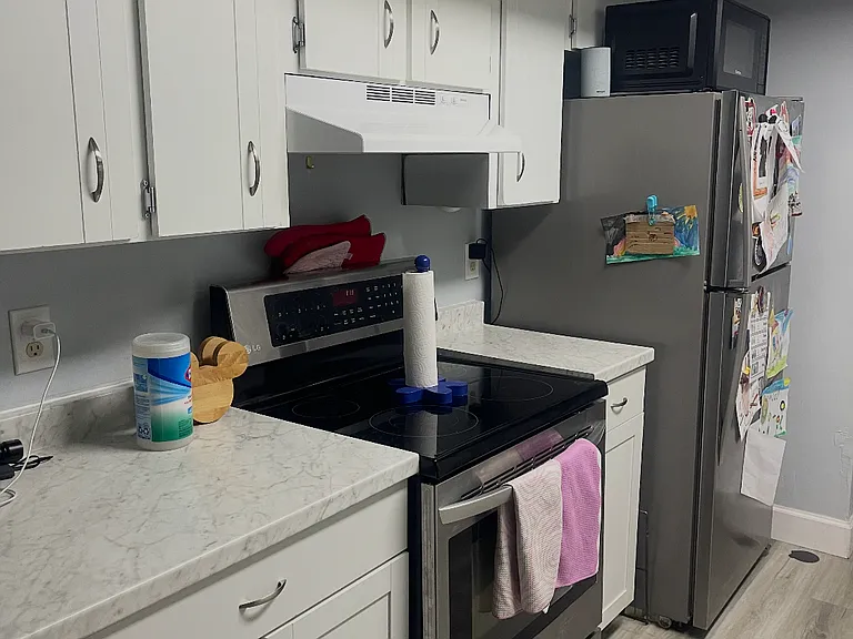 Stove, stainless refrigerator, easy to clean vinyl flooring