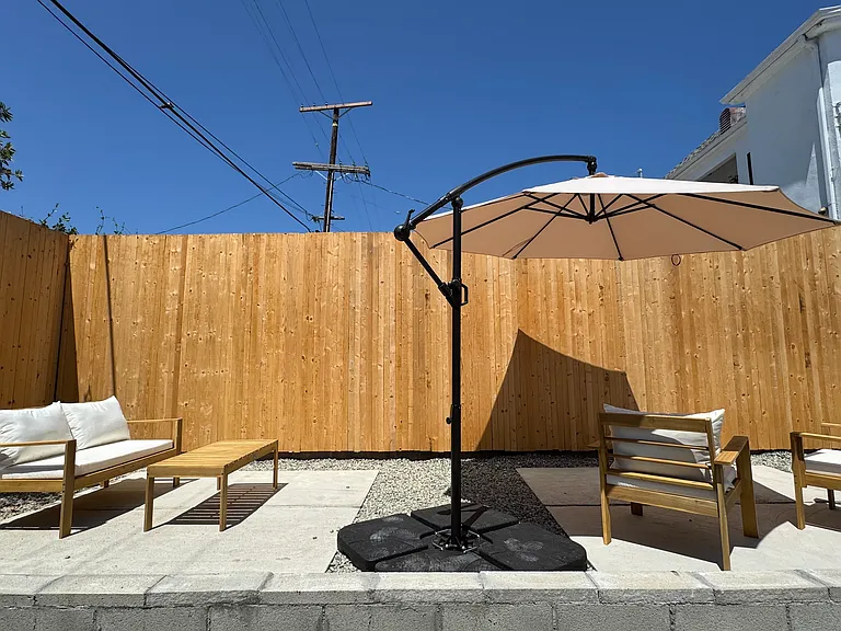 Backyard Outdoor patio accessible from backdoor / stairs of unit.