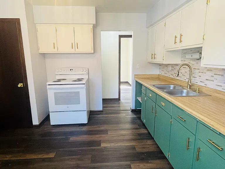 Kitchen. Pantry, new stove, garbage disposal, new refrigerator.