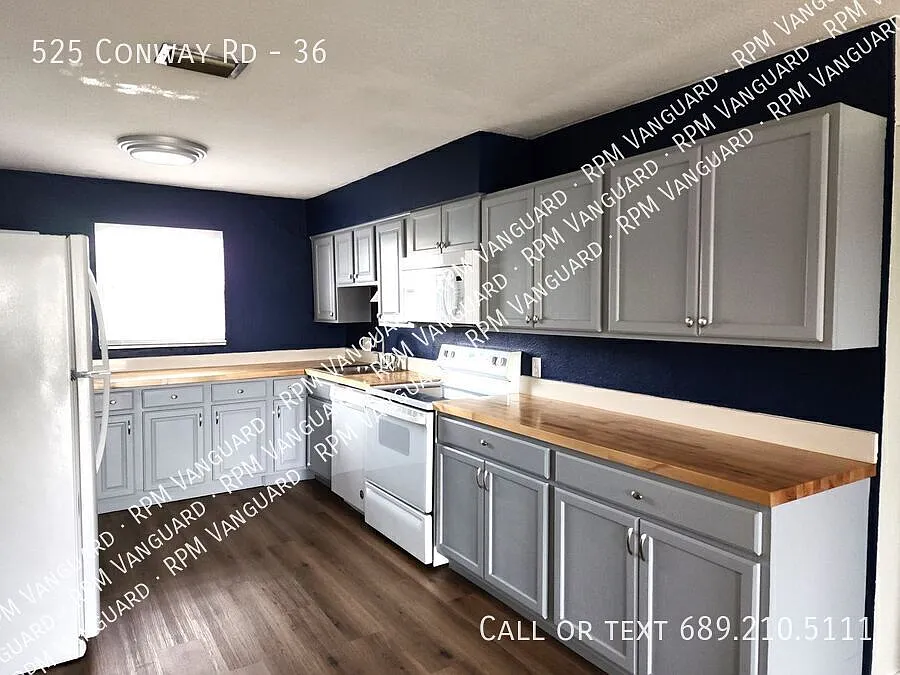 Second Floor Condo Unit with Balcony and Pool View — Photo 4
