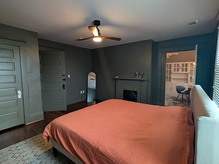 Bedroom 2 with attached walk-in closet, study space, and bathroom.