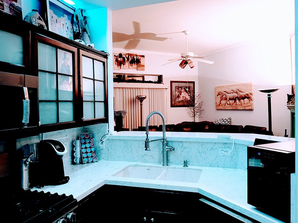 Open floor plan with easy conversation from kitchen to LV to dining room.and 2-sided clean gas fireplace.