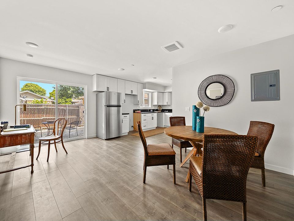 Lovely open space for dining, view outside the window will now have pretty white fence and hedge leading to private yard!
