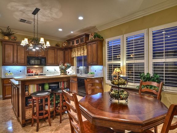Gourmet Chef's Kitchen with Granite Slab Countertops & Custom Cabinetry.