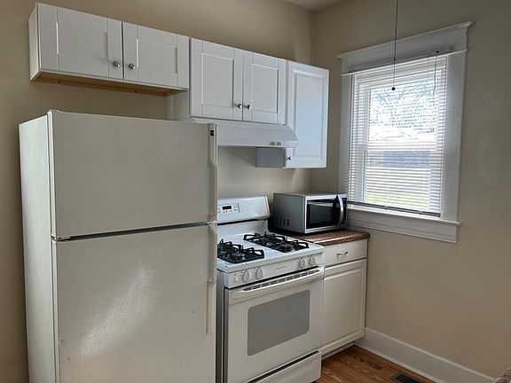 Kitchen- new cabinets and exhaust fan.