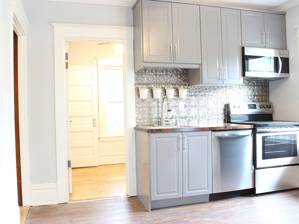 2018 Kitchen with dishwasher and over range microwave in stainless steel.
