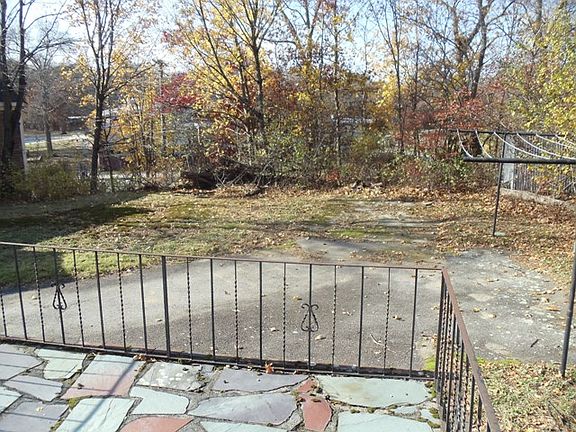 Back yard with stone patio