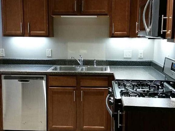 New birch cabinets, tiled kitchen