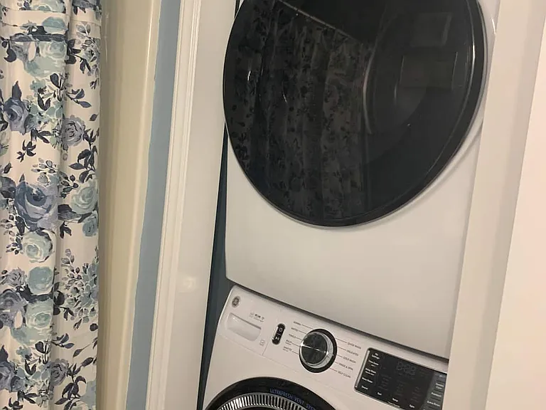 Guest bathroom with full size washer/dryer