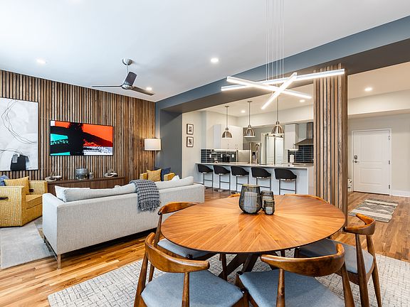 Cool fully furnished condo has all the luxury finishes. Art work over consul is a TV. This 1 year new complete gut renovation is in the hottest area of Cincinnati.
