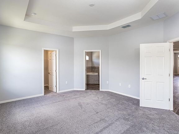 Spacious owner s suite with a dual vanity en-suite bath - New home for sale in Lake Alfred, FL. Phot