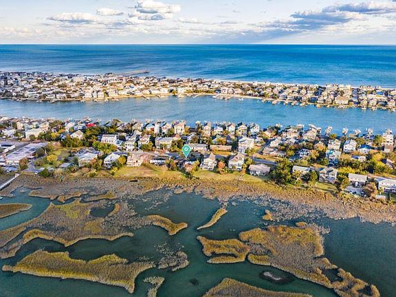 Subject property is adjacent to the green arrow on the left side.