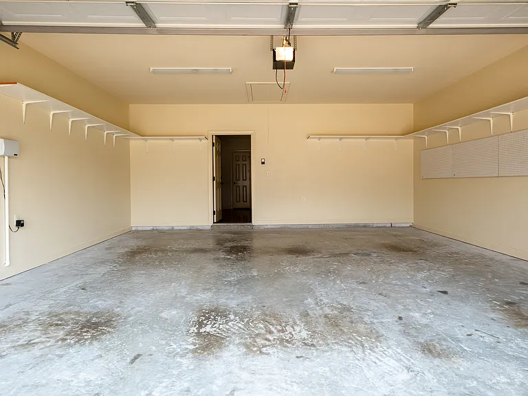 2 car garage with shelving.