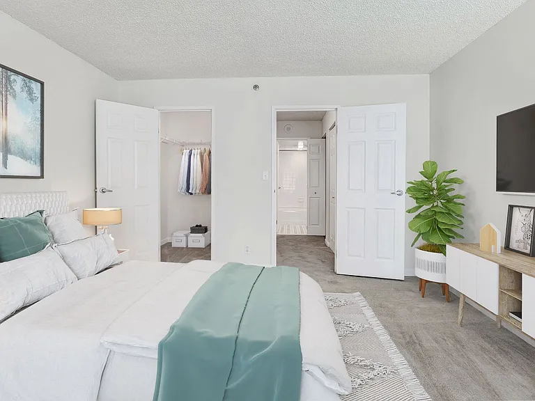 Apartment bedroom with closet space (virtually staged)