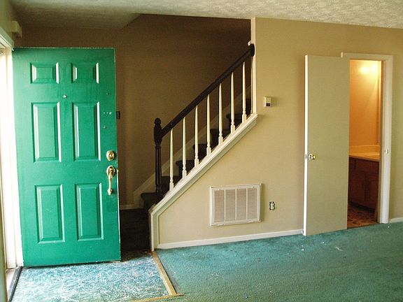 Entry into Living Room w/ Half Bath