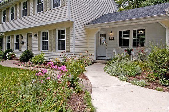 Brick paver Walkway leads to front porch & entry.