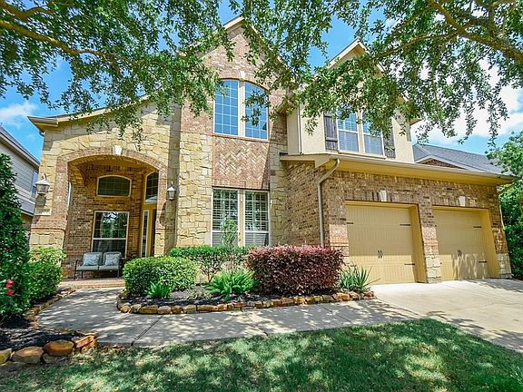 Double wide driveway provides plenty of additional parking areas. Full sprinklers keep the lawn and landscaping healthy.