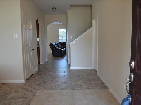 Large 2 story entry w/formal dining on the left.