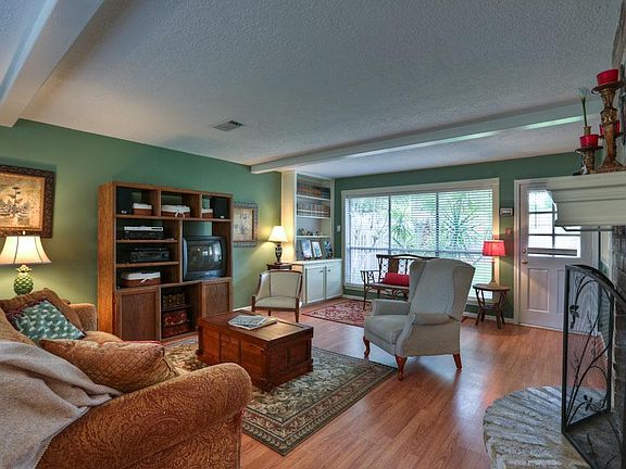 Expansive family room with wall of windows looking onto large backyard.