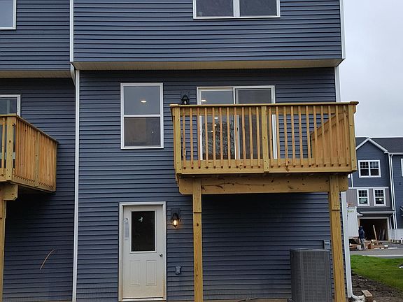 Rear deck off of main living floor; utility room/storage area inside the white door