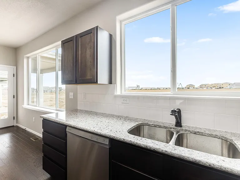 Views of the Future Park with Beautiful Open Kitchen with Expresso Cabinets, Granite Countertops, Stainless Steel Appliances and LVP Flooring