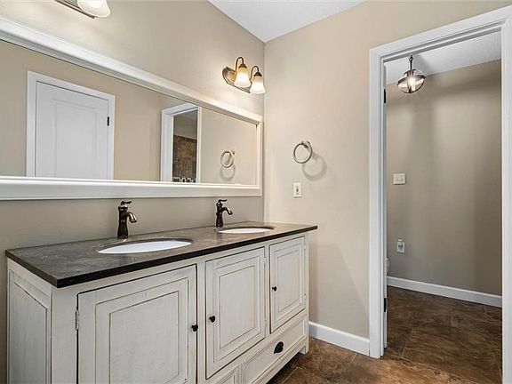 Updated double sink vanity with large mirror.  