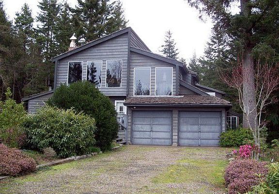 Front of home with long driveway