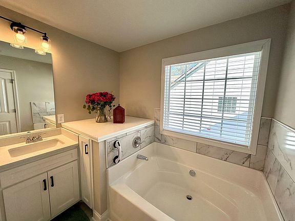 Master bathroom with large bathtub
