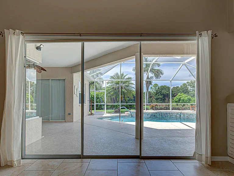 Family room looking out to lanai and pool