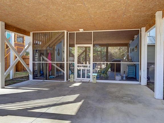 Car port with view of screened lanai