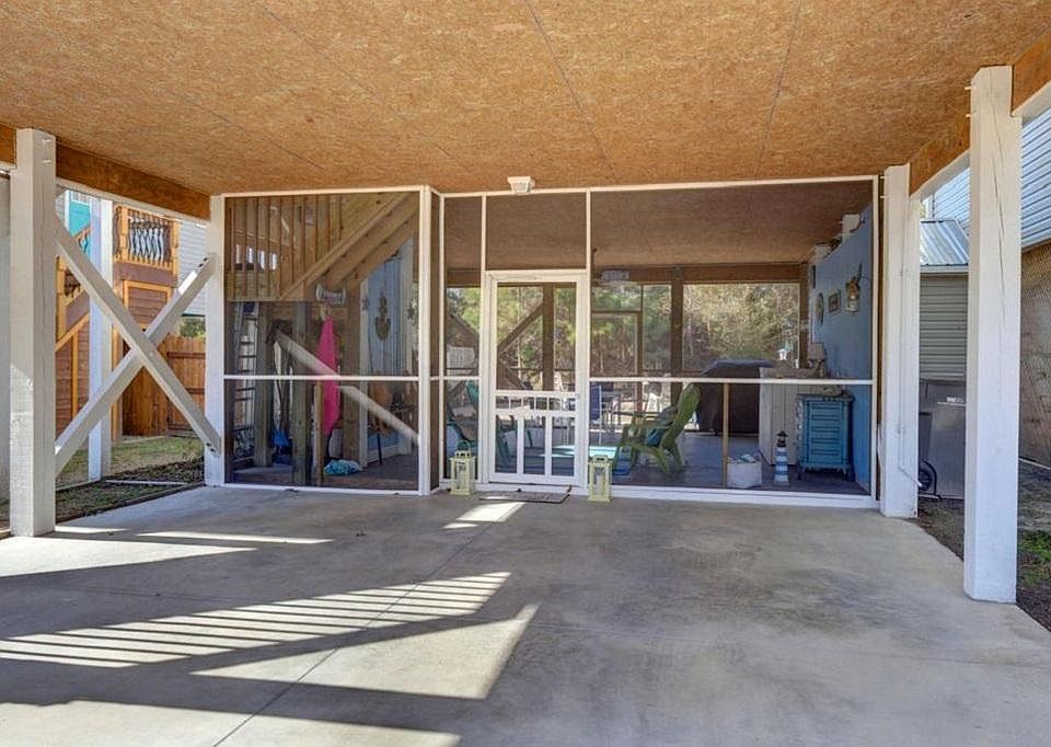 Car port with view of screened lanai