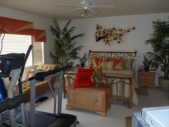 Master bedroom with mirror door on closet 