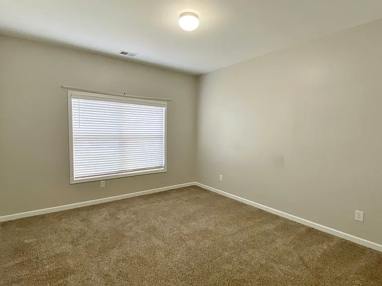 Upstairs bedroom facing road