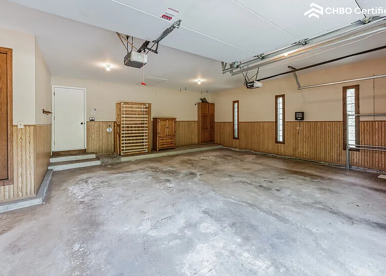 Garage - 2.5 car spaces with storage cabinets and closet