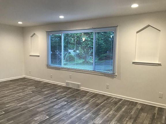 Large living room with easy to clean vinyl plank flooring