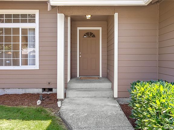 Visitors or package deliveries will be sheltered from the sun or rain on the covered front porch.  